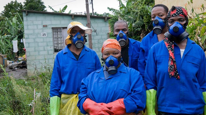"Workers emptying pit latrines in Durban" 
